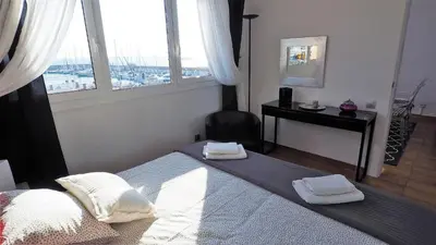 a bedroom with a bed with two towels on it at Cristina Port & Beach - Apartment in Masnou
