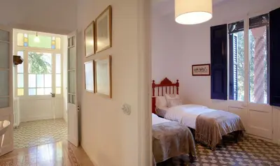 a bedroom with a bed and a window at Can Calixto in Aiguafreda