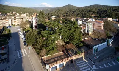 an overhead view of a city with buildings and trees at Can Calixto in Aiguafreda