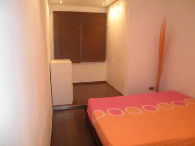 a small room with a bed and a window at Bacrou apartment, design loft near the sea in Barcelona