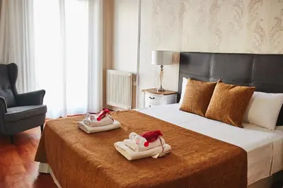 a hotel room with a bed with towels on it at Alcam Plaza Cataluña in Barcelona