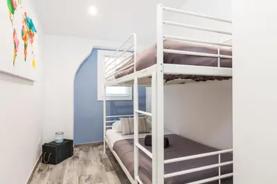 a bedroom with bunk beds in a dorm room at Vilasarmarlux II in Vilassar de Mar
