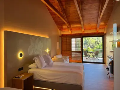 a bedroom with a bed in a room at Boutique hotel Urbisol in Calders