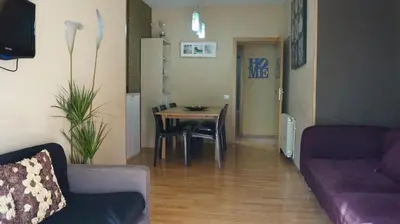 a living room with a couch and a table at Good-Apartments Barcelona in Barcelona