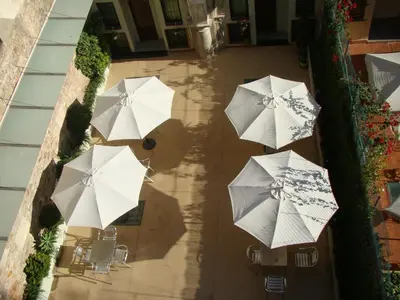 an overhead view of a group of white umbrellas at La Terrassa in Barcelona