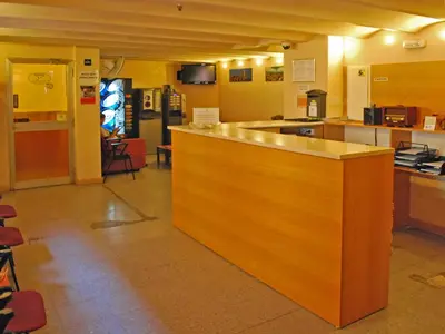 a kitchen with a wooden counter top in a room at Hostal Radio Barcelona in Barcelona