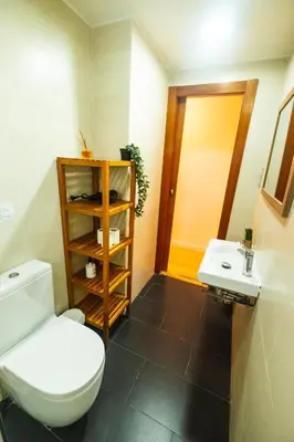 a bathroom with a toilet and a sink at RentBCN Park Guell in Barcelona