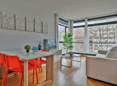 a living room with a table and a couch at 1213 - Ciutadella Nice Apartment in Barcelona