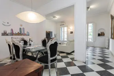 a dining room and living room with a table and chairs at 1229 - AWESOME CITY CENTER APARTMENT WITH TERRACE in Barcelona
