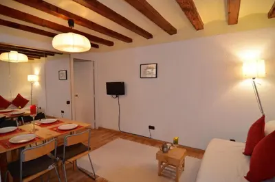 a living room with a couch and a dining room table at Central Apartment in Barcelona