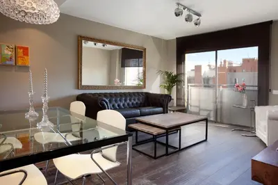 a living room with a glass table and a couch at Calabria Luxury in Barcelona