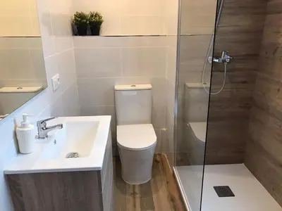 a bathroom with a toilet and a sink and a shower at Sweet BCN Studio with Terrace in Barcelona