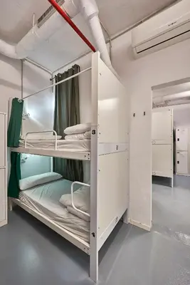 a room with two bunk beds in it at Hola Hostal Collblanc in Hospitalet de Llobregat