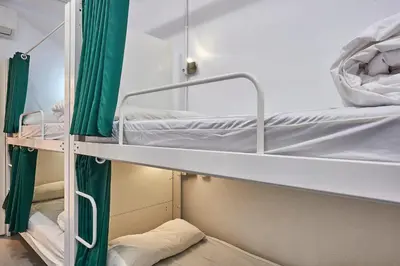 a pair of bunk beds in a hospital room at Hola Hostal Collblanc in Hospitalet de Llobregat