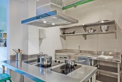 a kitchen with a counter top and a sink at Hola Hostal Collblanc in Hospitalet de Llobregat