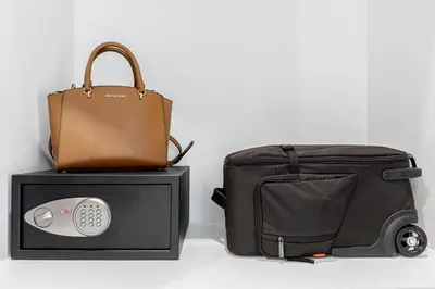 a briefcase and a bag sitting next to a microwave at Casa Lirio in Barcelona