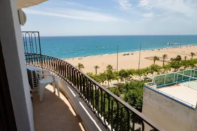 a balcony with a view of the beach at Hotel Haromar in Calella