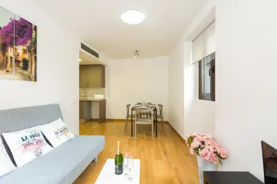 a living room with a couch and a table at Matarolux 14 in Mataró