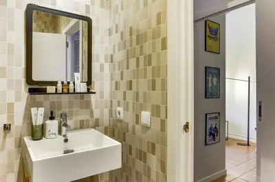 a bathroom with a sink and a mirror at Sweett - Ausias Marc in Barcelona