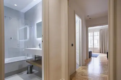 a bathroom with a sink and a bath tub at Tendency Sagrada Familia Luxury in Barcelona
