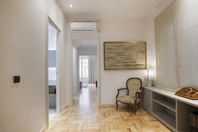 a hallway with a desk and a chair in a room at Tendency Sagrada Familia Luxury in Barcelona