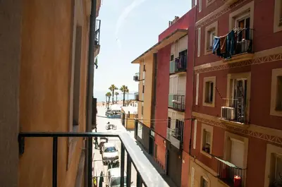 a view of a city street from a balcony at Barcelona Beach Apartments in Barcelona