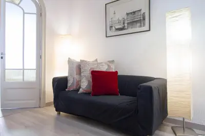 a white dresser with a plant on top of it at Armapana in Barcelona
