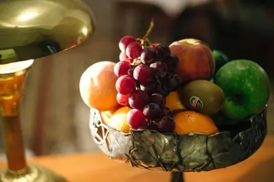 a bowl of fruit sitting on top of a table at Circa 1905 in Barcelona