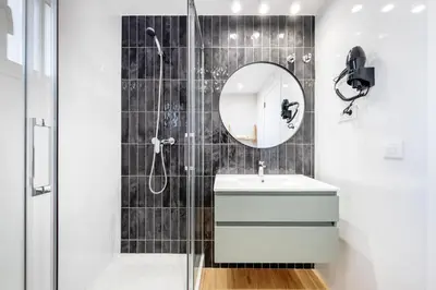 a bathroom with a sink and a mirror at AinB Barcelona Sants Apartments in Barcelona