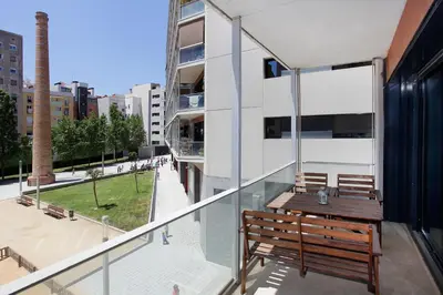 a balcony with a bench on a building at 1215 - Ciutadella Pretty Apartment in Barcelona
