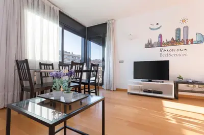 a living room with a table and a tv at 1217 - POOL AND BEACH NICE APARTMENT II in Barcelona