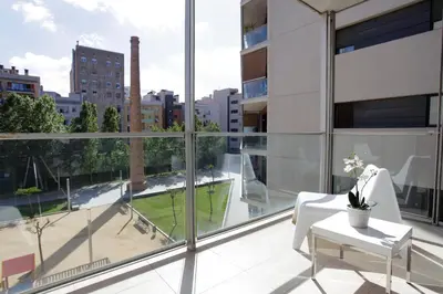 an apartment balcony with a view of a city at 1214 - TWO BEDROOMS CIUTADELLA APARTMENT in Barcelona