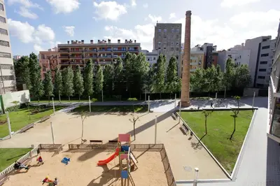 a park with a playground in a city at 1214 - TWO BEDROOMS CIUTADELLA APARTMENT in Barcelona
