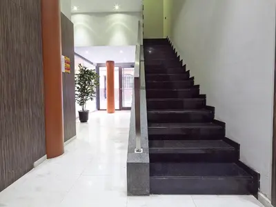 a hallway with a staircase in a building at Bonavista Apartments - Virreina in Barcelona