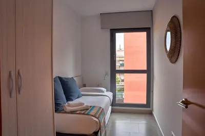 a small room with a bed and a window at Bonavista Apartments - Virreina in Barcelona