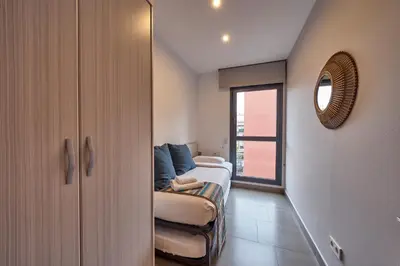 a living room with a couch and a window at Bonavista Apartments - Virreina in Barcelona