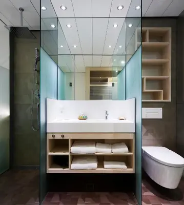 a bathroom with a sink and a mirror at Ako Suite Hotel in Barcelona
