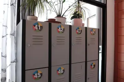 a row of lockers with potted plants on top at Alternative Creative Youth Hostel Barcelona in Barcelona