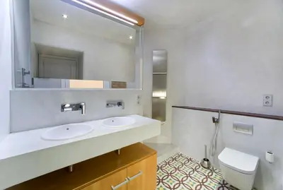 a bathroom with two sinks and a mirror at Montaber Apartment - Bailén in Barcelona