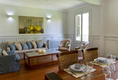 a living room with a couch and a table at Montaber Apartment - Bailén in Barcelona