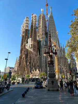 a large building with tall spires on a city street at Sagrada Familia Apartment 265 in Barcelona