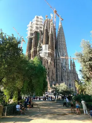 a large cathedral with people standing in front of it at Sagrada Familia Apartment 265 in Barcelona