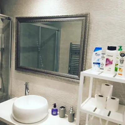 a bathroom with a sink and a mirror at Family Deluxe Apartment Beach in Castelldefels