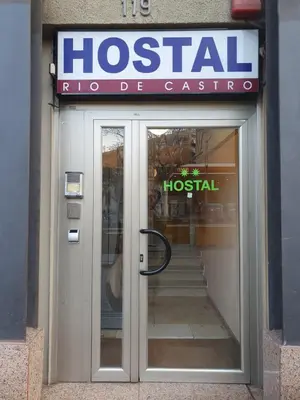 a hospital sign over a door of a building at Hostal Rio De Castro in Barcelona