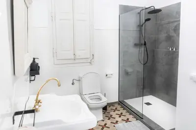 a bathroom with a shower and a toilet and a sink at B-Garden BCN in Barcelona