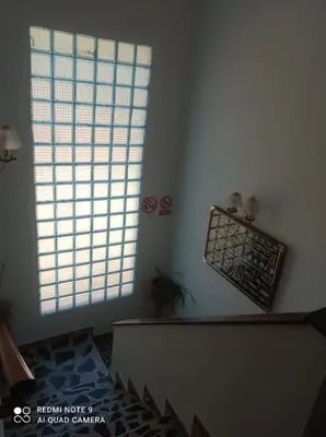 a living room with a couch and a window at Casa Calafell in Segur de Calafell