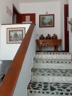 a kitchen with a white refrigerator and a stove at Casa Calafell in Segur de Calafell