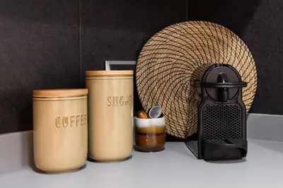 a counter with three coffee cups and a coffee maker at KeyFamily Paradise in Barcelona