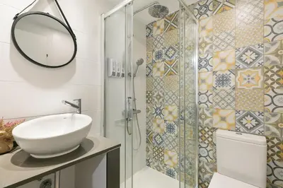 a bathroom with a sink and a shower at KeyFamily Loft Las Ramblas in Barcelona