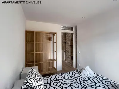 a bedroom with a bed and a window at apartamento en el centro in Vilanova i la Geltrú